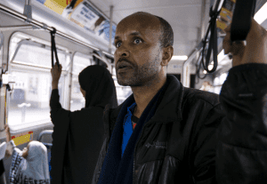 Somali man rides a city bus