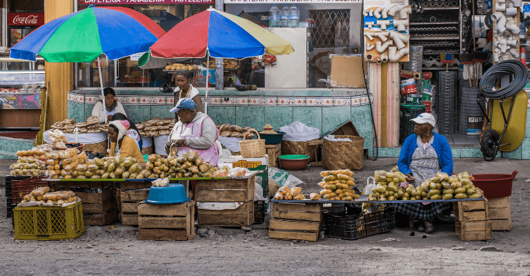 Women working at market in Ecuador - International Women's Day