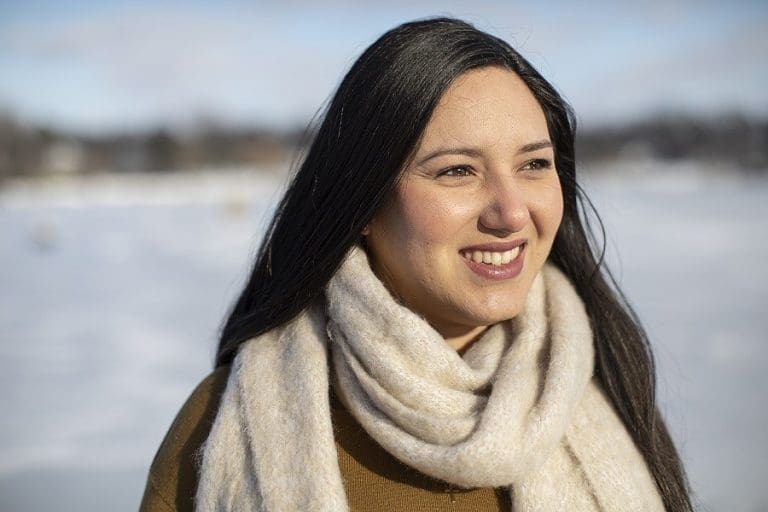 LuisanaMendez outdoors with snow in background, International Women's Day and pandemic reflections