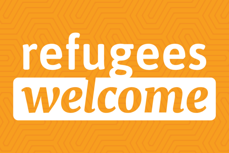 White text that reads "refugees welcome" on an orange background