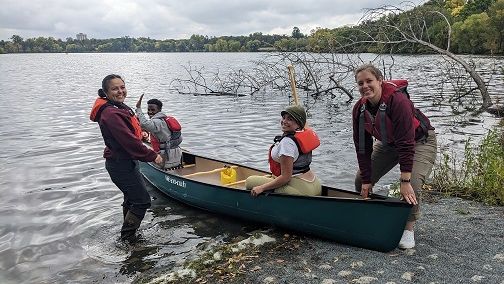 New Americans learn about canoeing on the mississippi river.